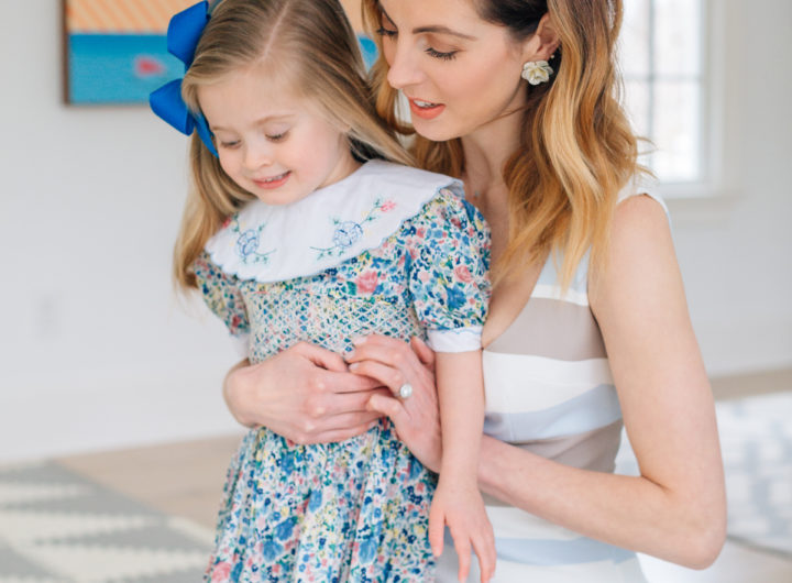 Eva Amurri Martino holds three year old daughter Marlowe Martino on her lap wearing a floral dress for Easter