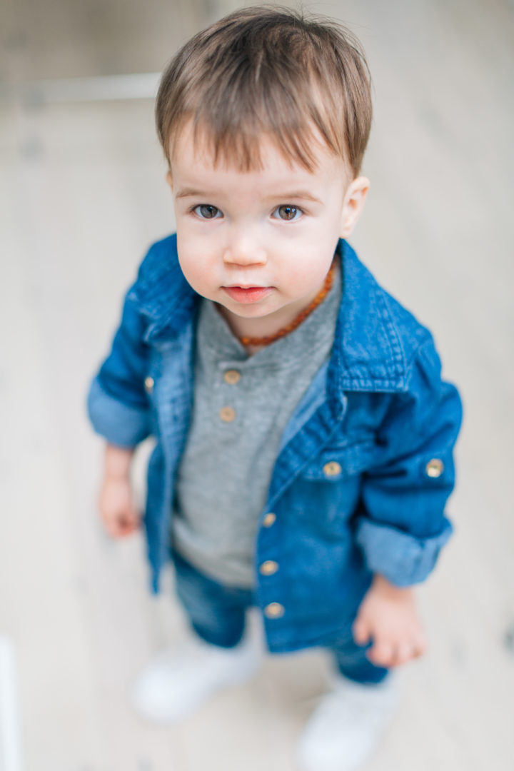 Stylish tot, Major Martino, wears a trendy denim button up over a grey t-shirt.