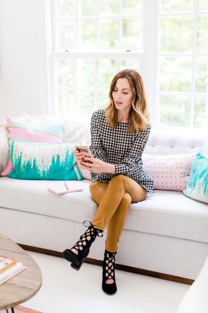Eva Amurri Martino scrolls through her cell phone while she sits in the REZTT studio in Connecticut