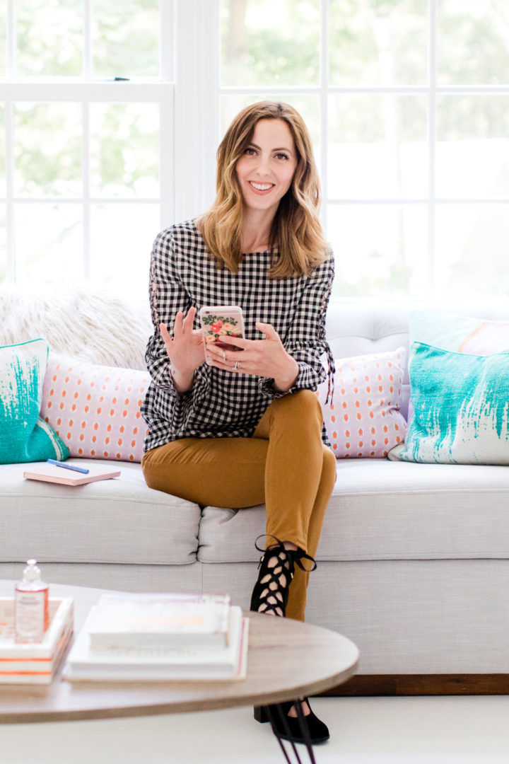 Eva Amurri Martino scrolls through her cell phone while she sits in the REZTT studio in Connecticut
