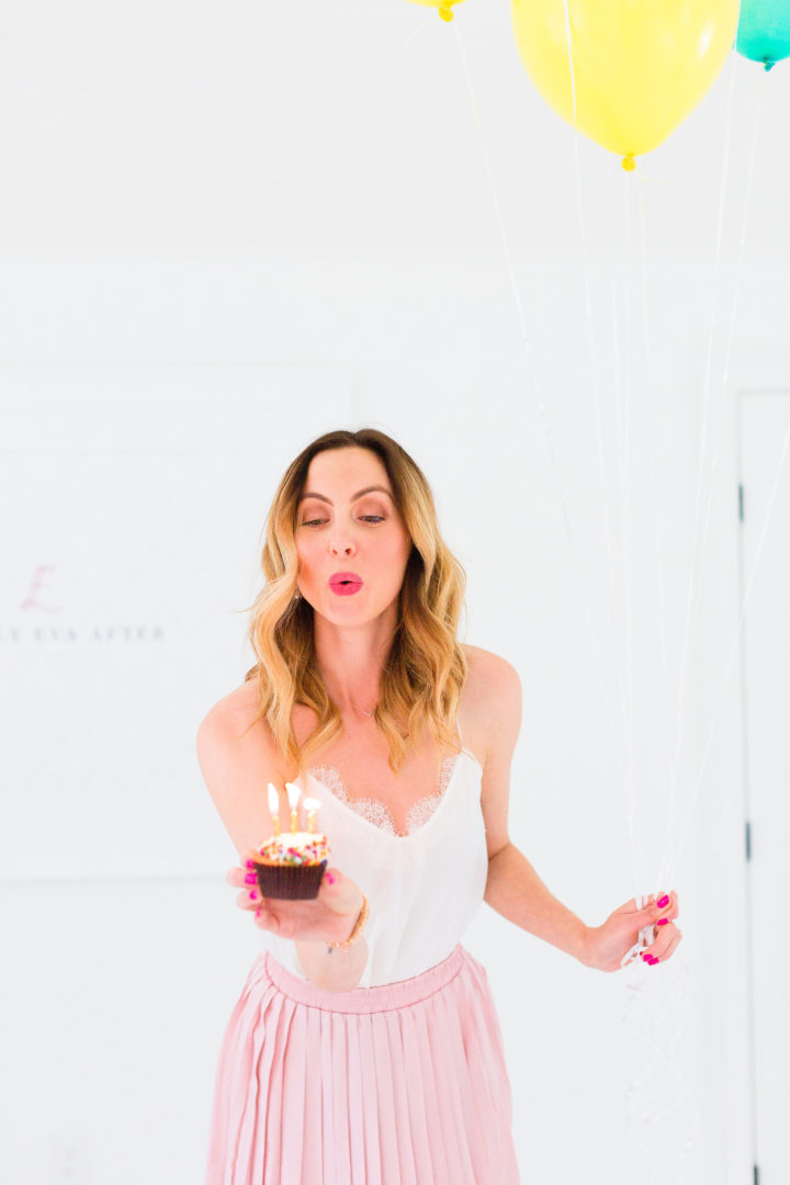 Eva Amurri Martino blows out the candles on a cupcake commemorating the 3rd birthday of her blog, REZTT