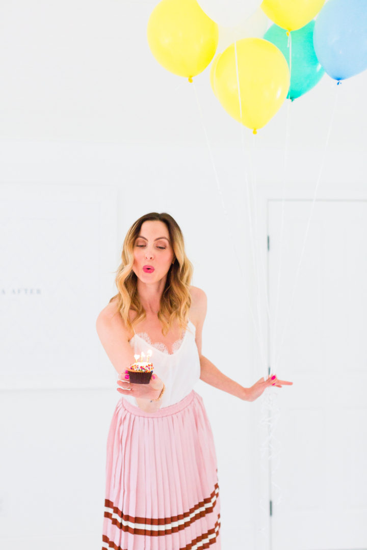Eva Amurri Martino blows out the candles on a cupcake commemorating the 3rd birthday of her blog, REZTT
