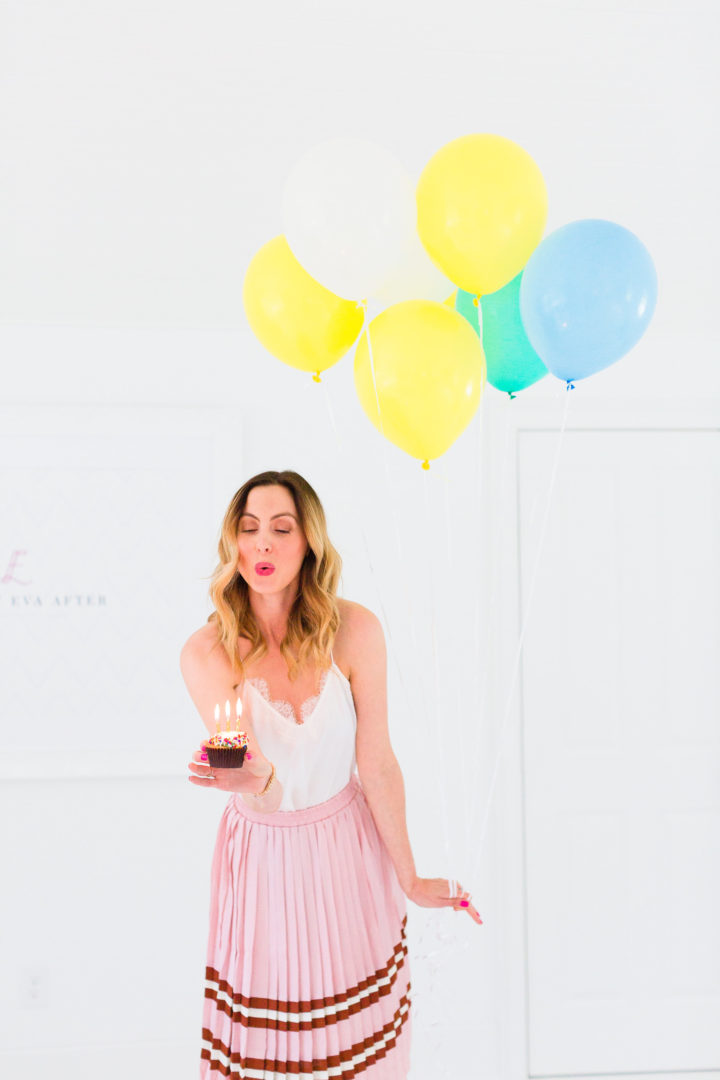 Eva Amurri Martino blows out the candles on a cupcake commemorating the 3rd birthday of her blog, REZTT