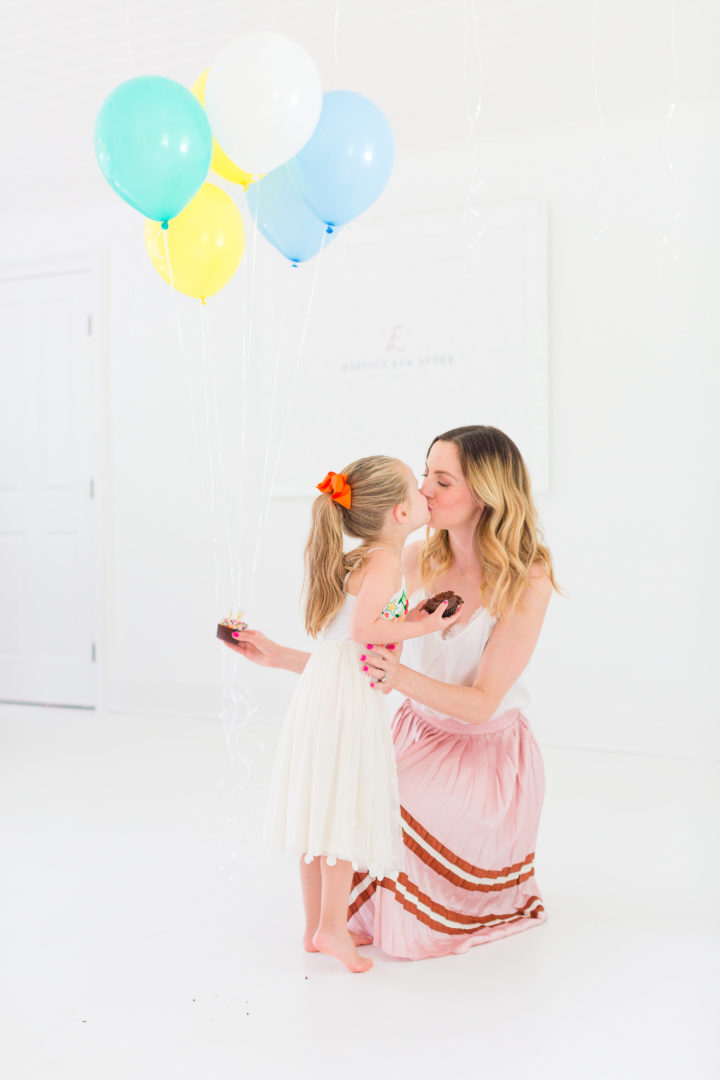 Eva Amurri Martino sweetly kisses her daughter Marlowe while they both enjoy cupcakes to celebrate the 3rd birthday of her blog REZTT