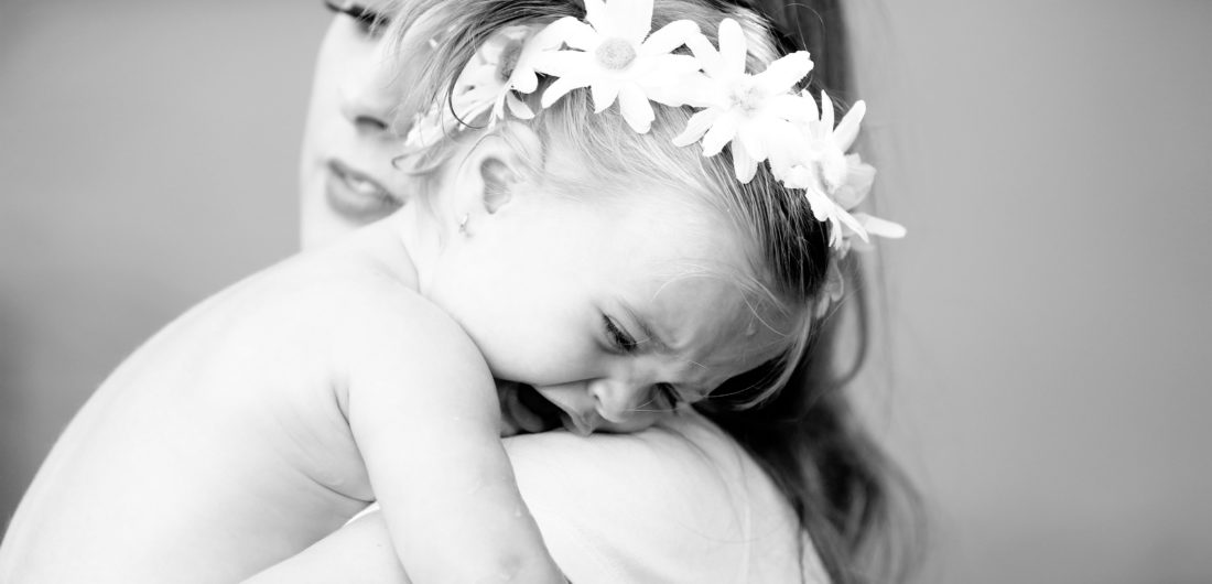 Eva Amurri Martino holds toddler daughter Marlowe in her arms in the yard of their sherman oaks home
