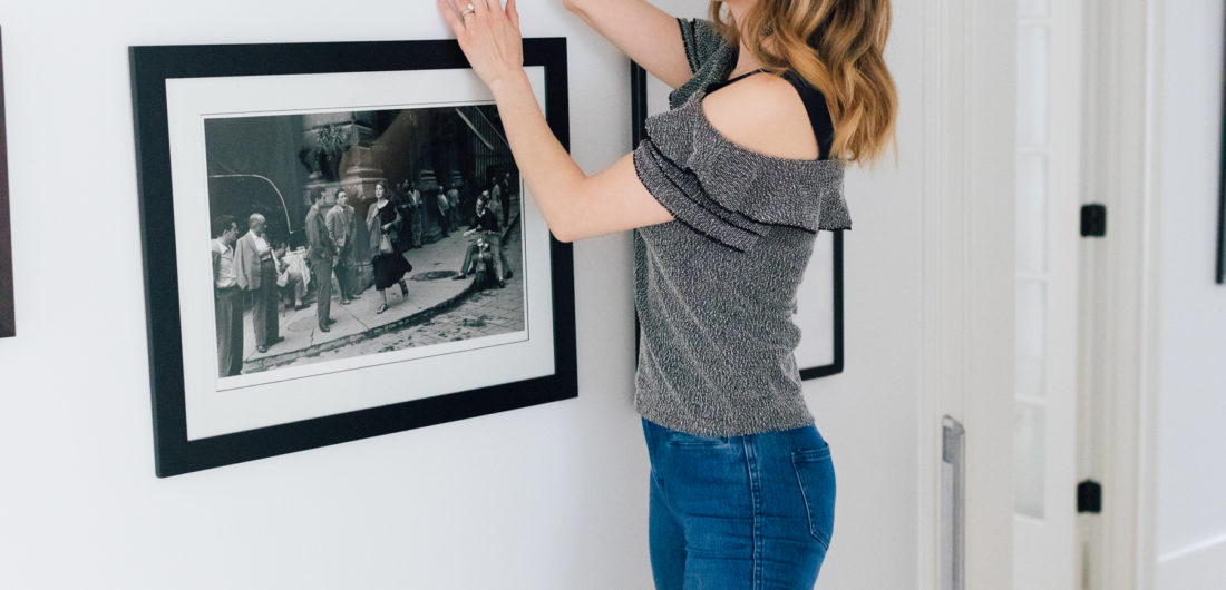 Eva Amurri Martino stands in the hallways of her connecticut home and selects a black and white photograph from the wall as she decides what to pack and what to give away before her family's move