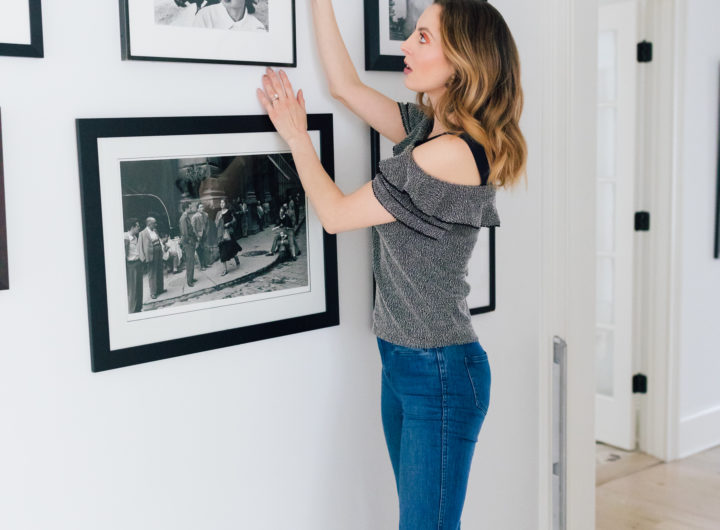 Eva Amurri Martino stands in the hallways of her connecticut home and selects a black and white photograph from the wall as she decides what to pack and what to give away before her family's move