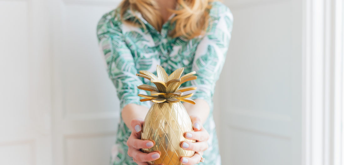 Eva Amurri Martino of REZTT wears a green floral dress and shares her Jamaica packing list