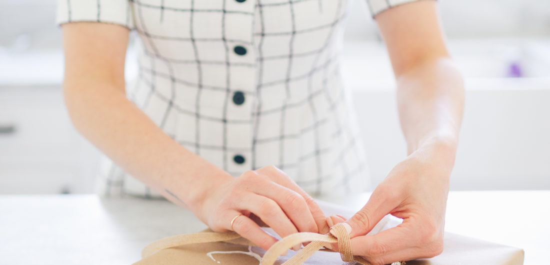 Eva Amurri Martino wraps a gift in stamped Easter wrapping paper
