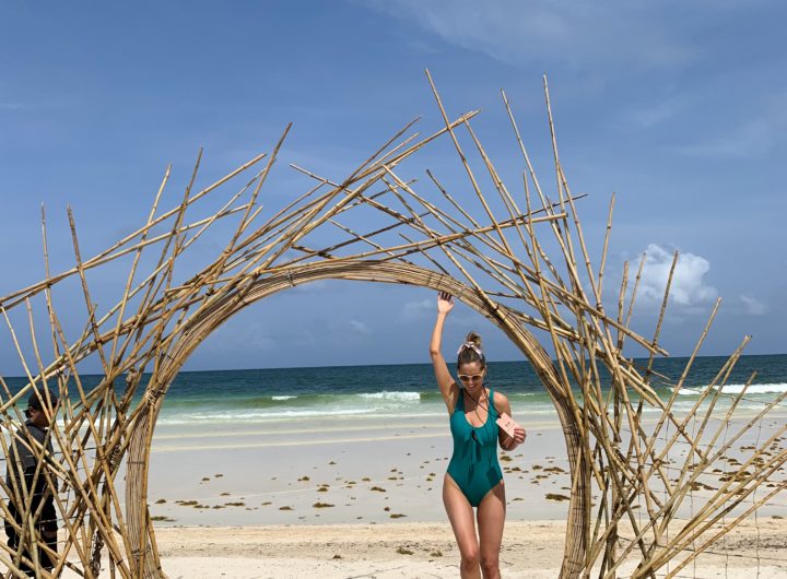 Eva Amurri Martino of REZTT frolicking on a beach at Summit Tulum