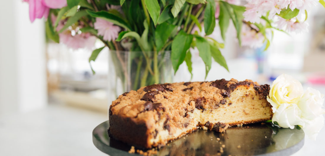 Eva Amurri Martino's coffee cake next to a vase of gorgeous flowers