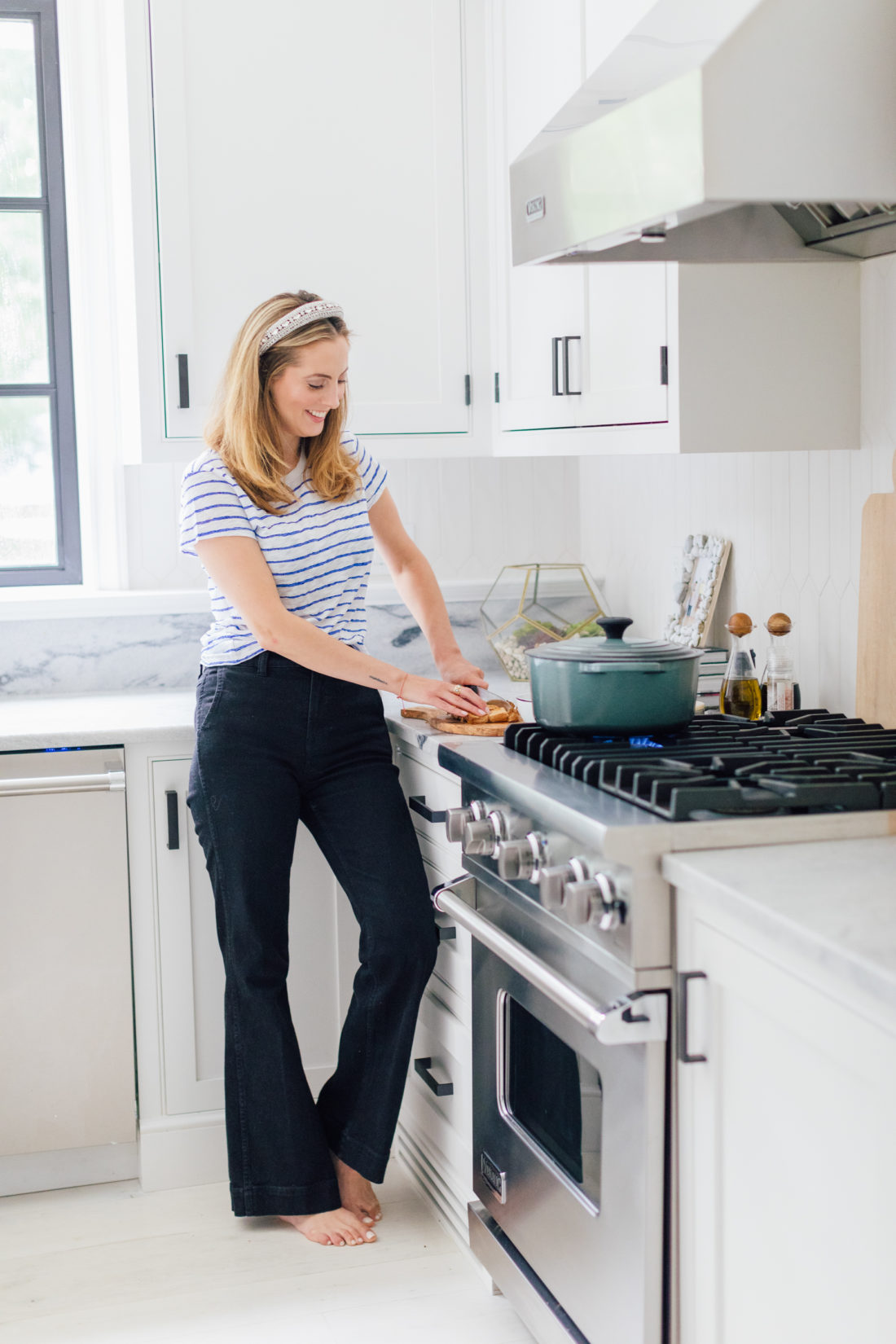 Eva Amurri Martino chops up bread for her Grilled Cheese Croutons