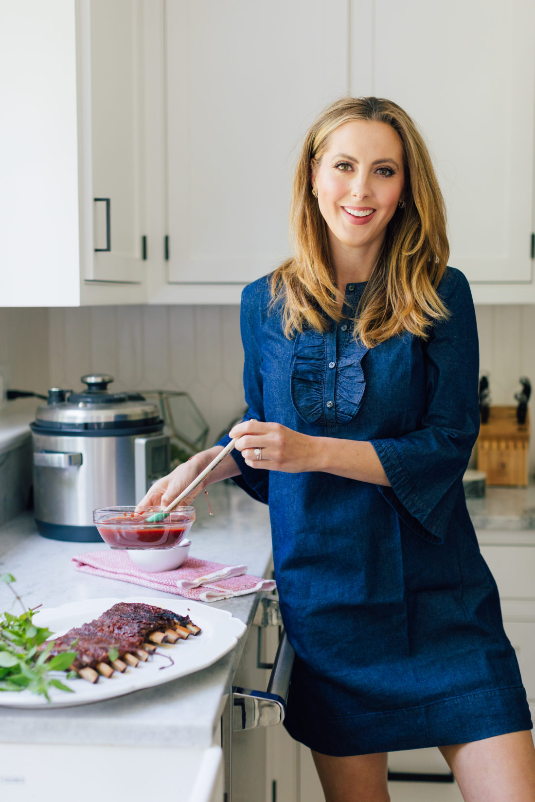 Eva Amurri Martino paints her Stone Fruit BBQ Sauce onto her dry rub ribs