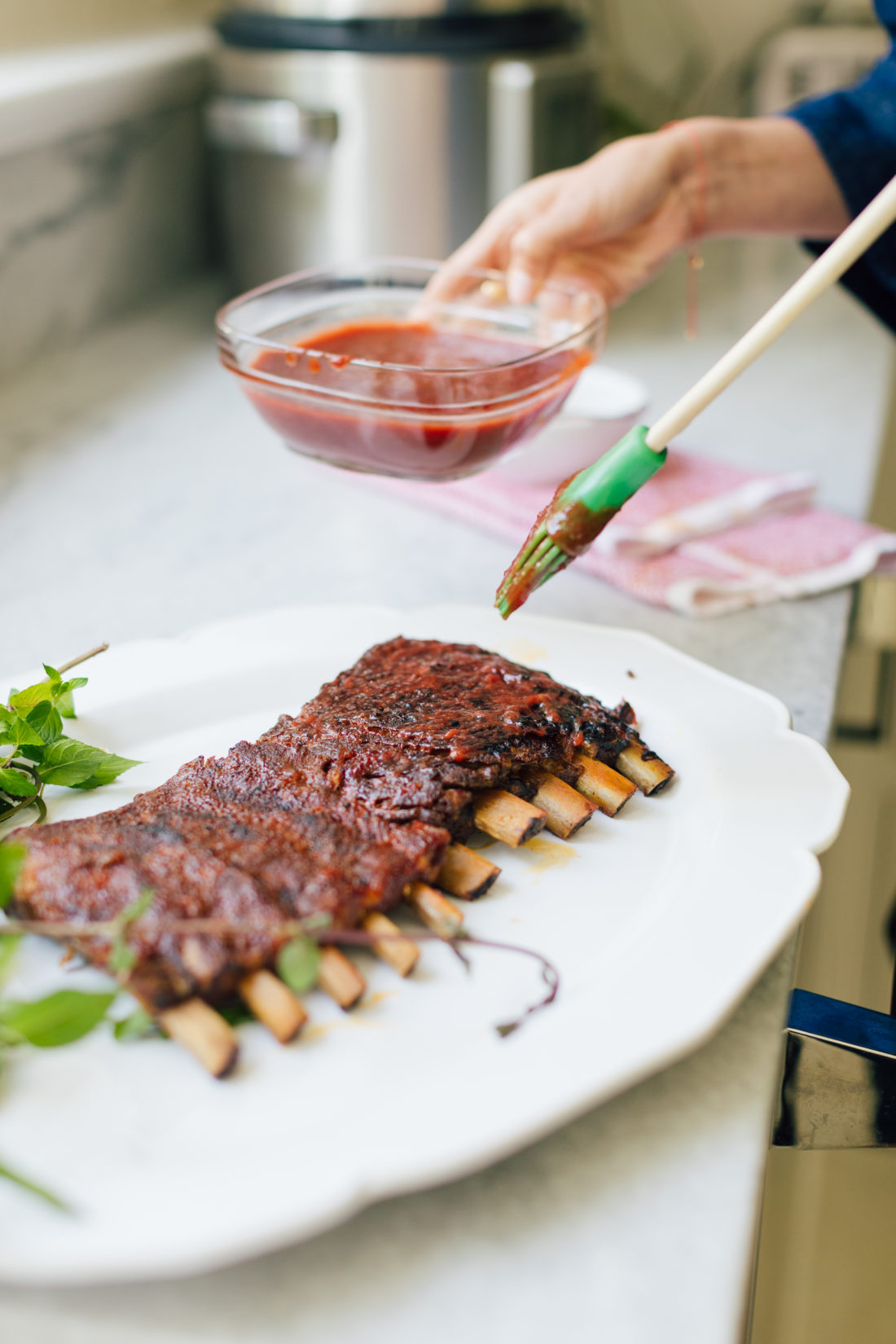 Eva Amurri Martino paints her Stone Fruit BBQ Sauce onto her dry rub ribs