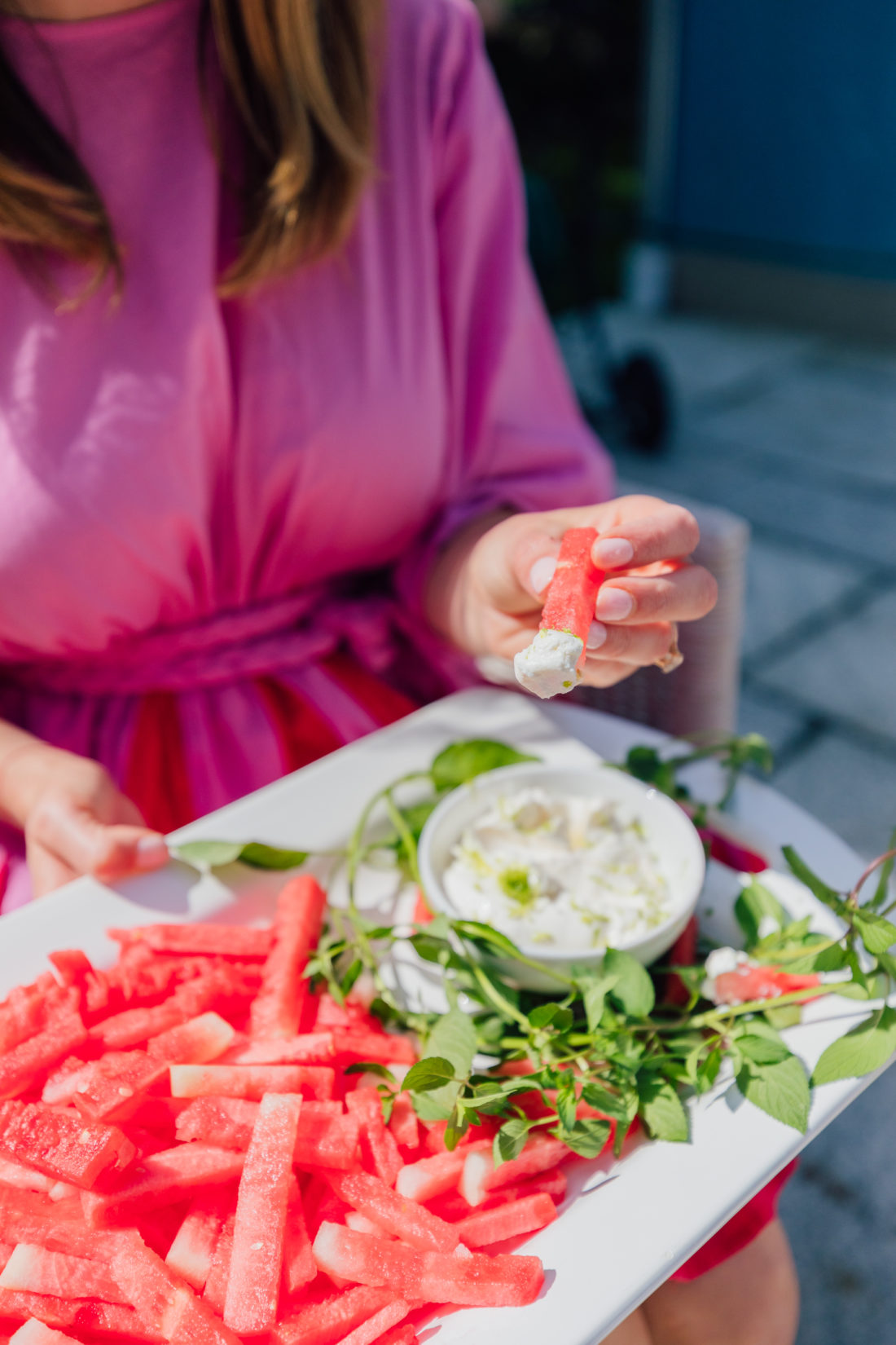 Eva Amurri Martino dips a watermelon fry into a yogurt dip