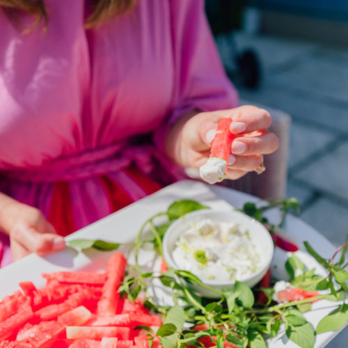 Eva Amurri Martino dips a watermelon fry into a yogurt dip
