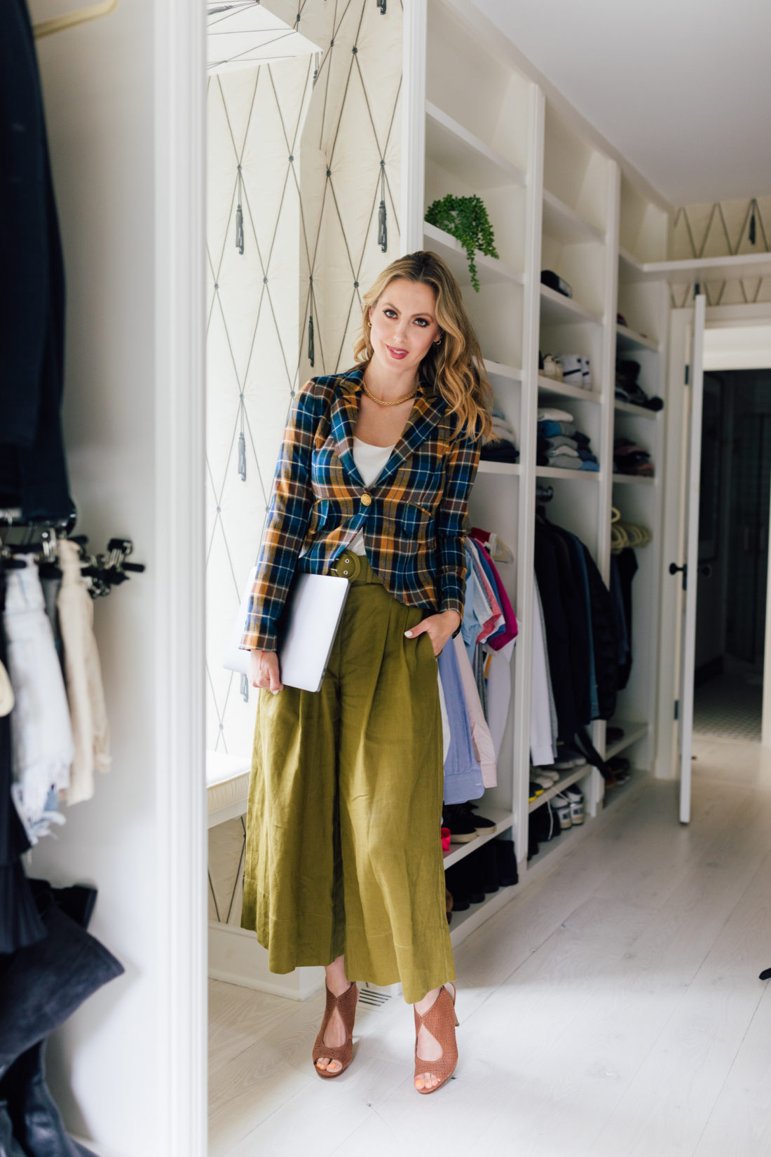 Eva Amurri Martino wears a plaid blazer in her walk-in closet